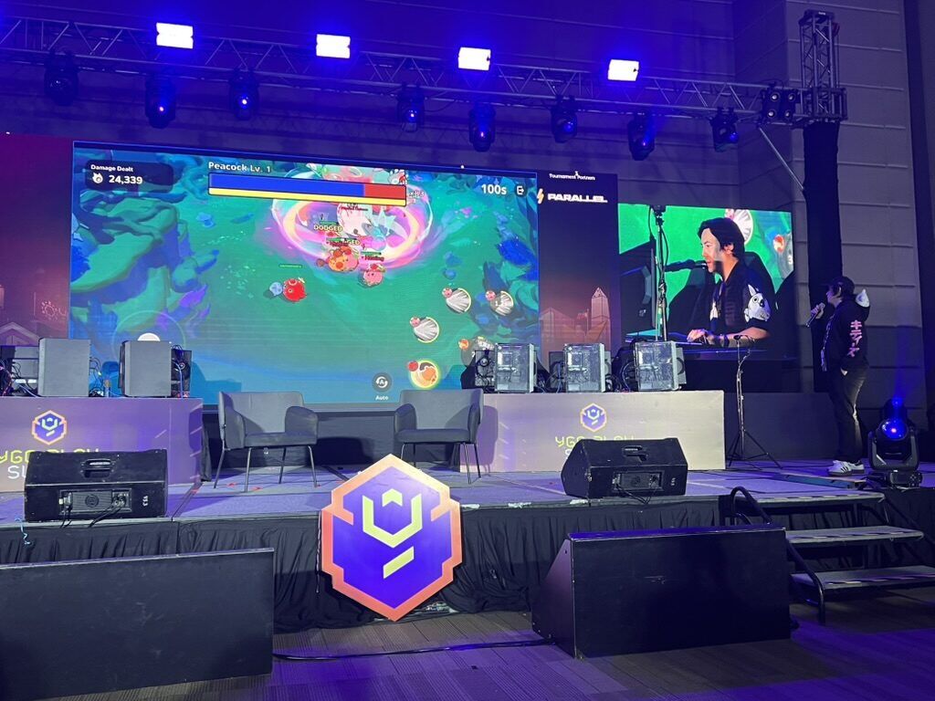 Jihoz And Cagy Showcasing The In-Game Shop And Boss Fight From Axie Infinity Atias Legacy During The Final Day Of Ygg Play Summit