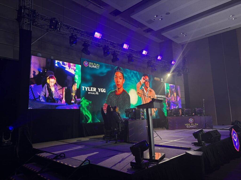 Ubisoft Executive Producer Sylvain Loe Mie Awarding Tournament Champion On Stage At Ygg Play Summit 2025